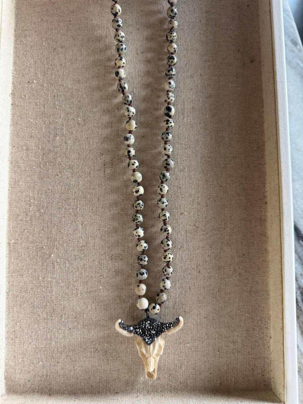 Cow skull beaded necklace.